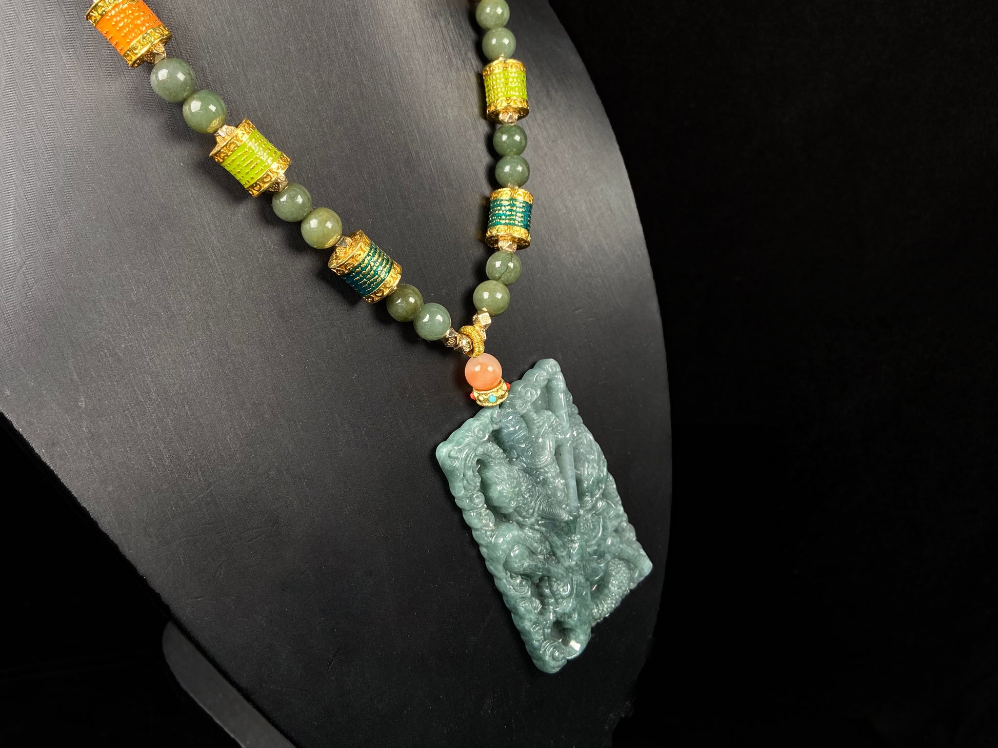 A deep green mighty guan gong jadeite pendant.