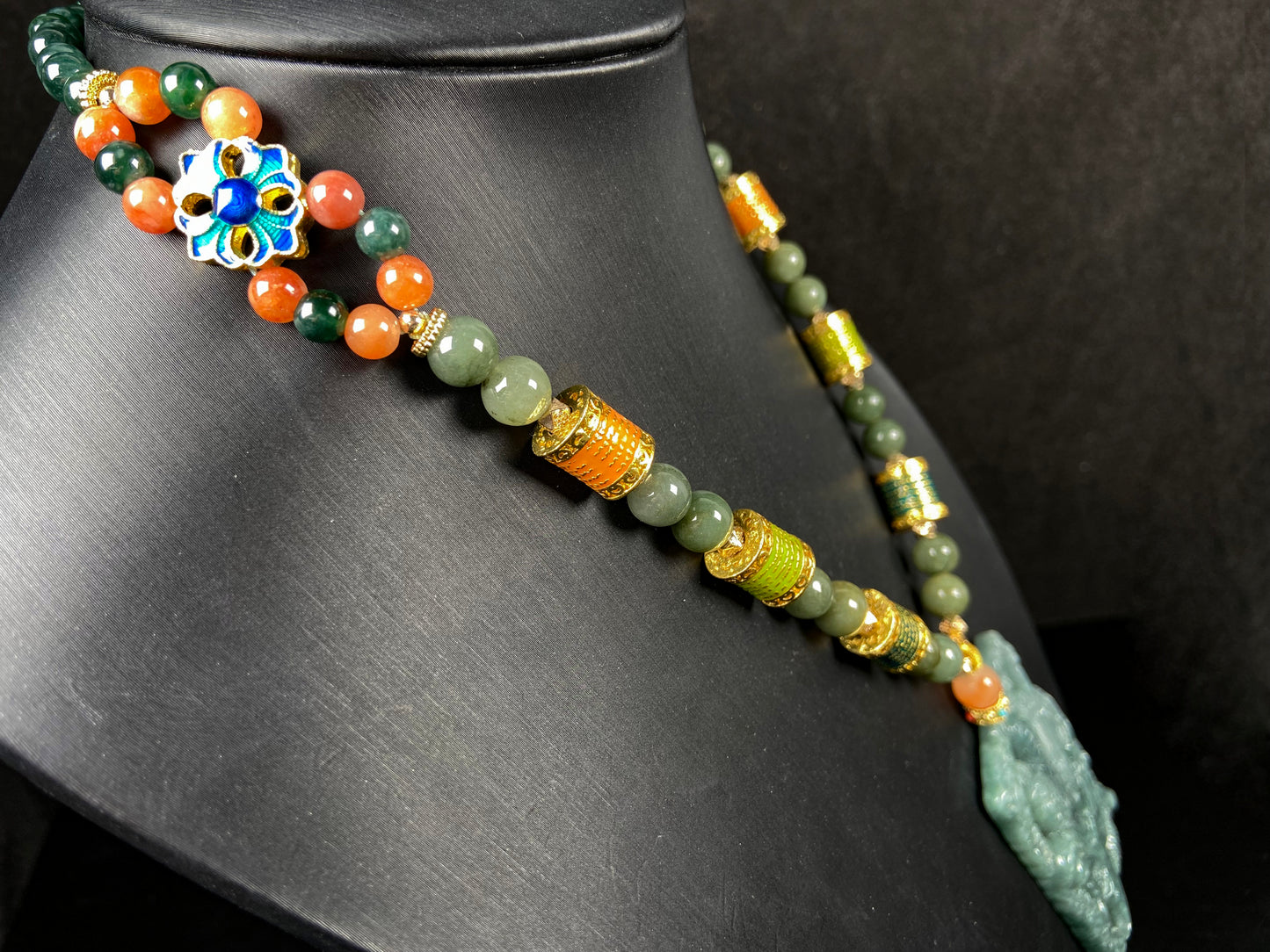 A deep green mighty guan gong jadeite pendant.