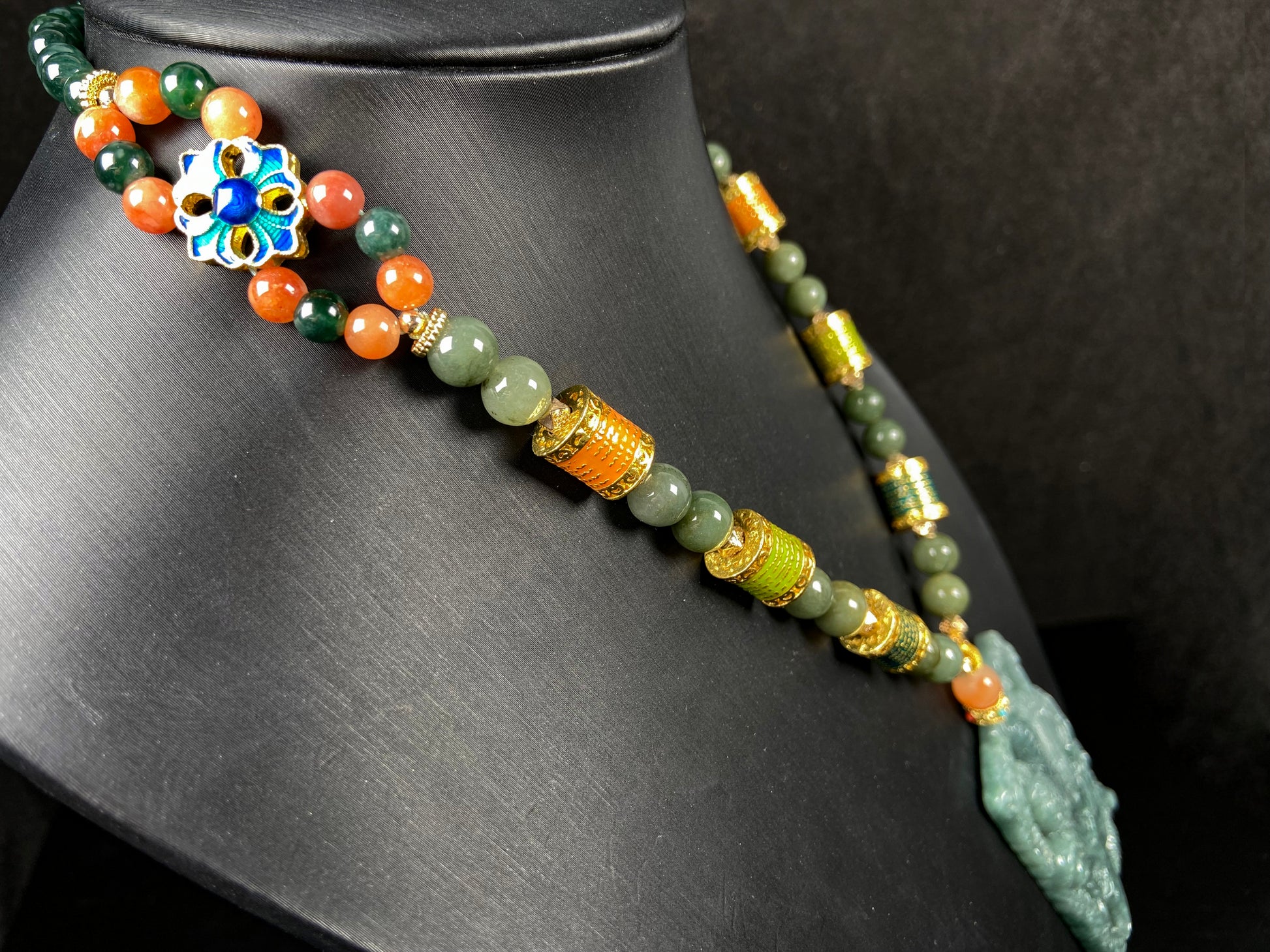 A deep green mighty guan gong jadeite pendant.