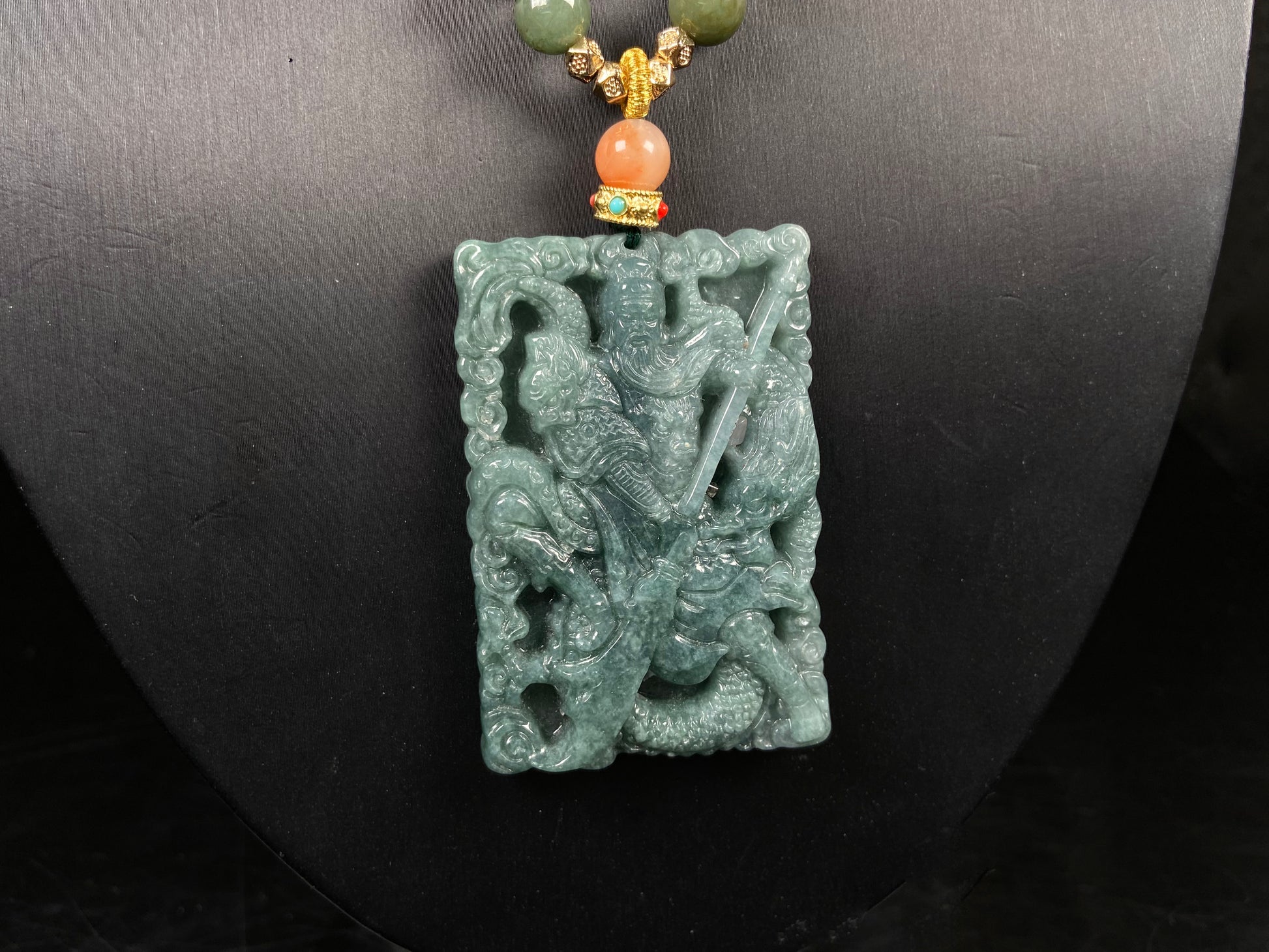 A deep green mighty guan gong jadeite pendant.