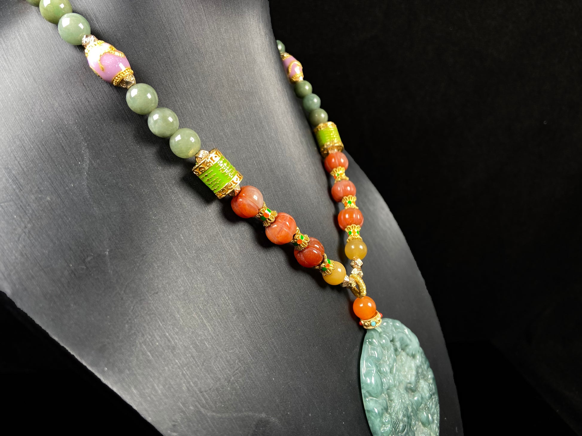 A deep green mountain scenery  jadeite pendant.