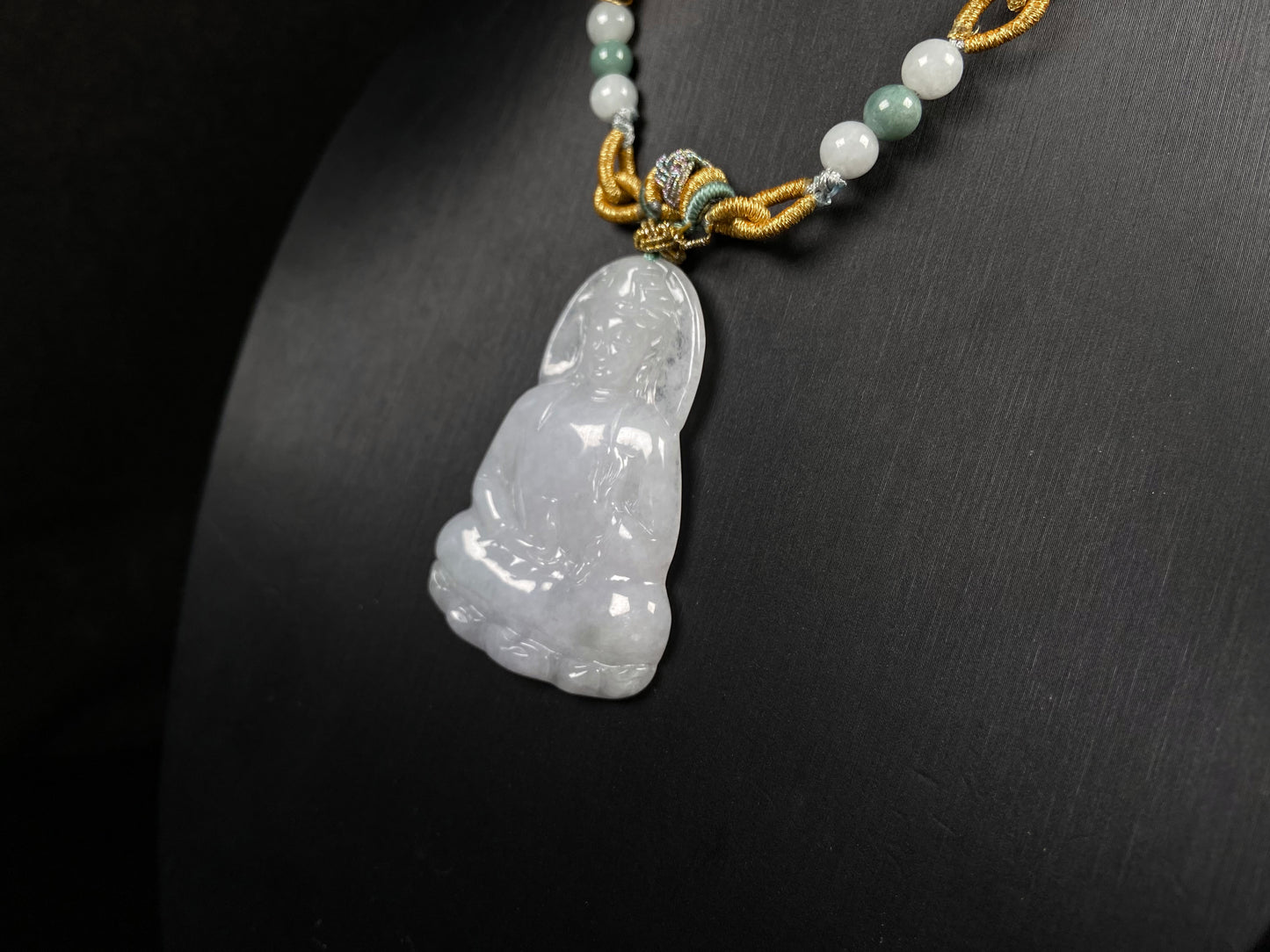 A serene white guanyin jadeite pendant.