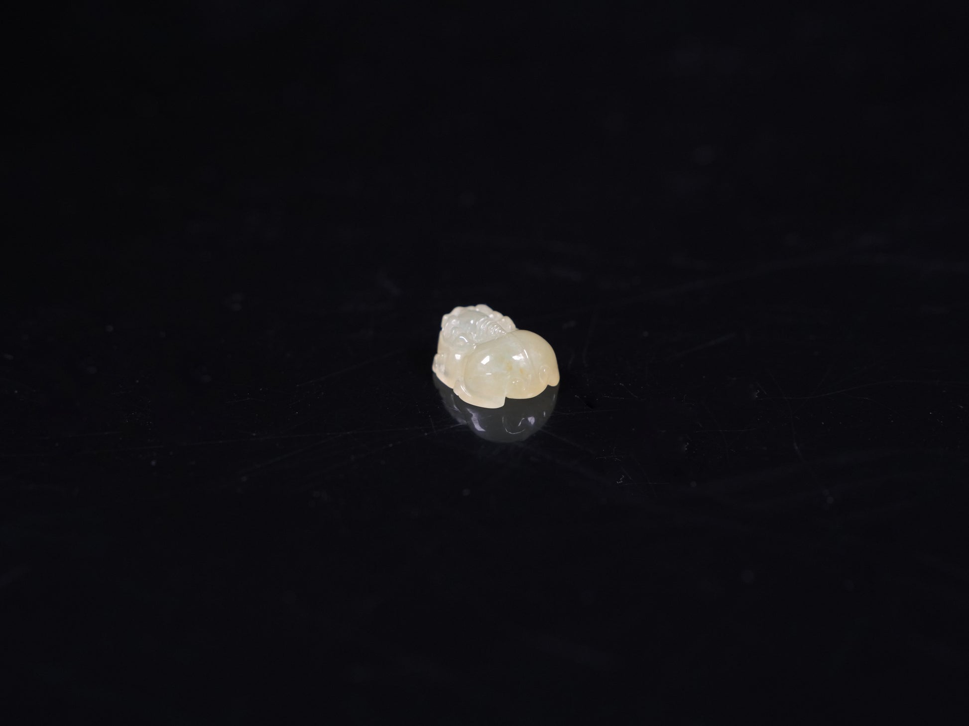 A warm yellow Pixiu loose jadeite.