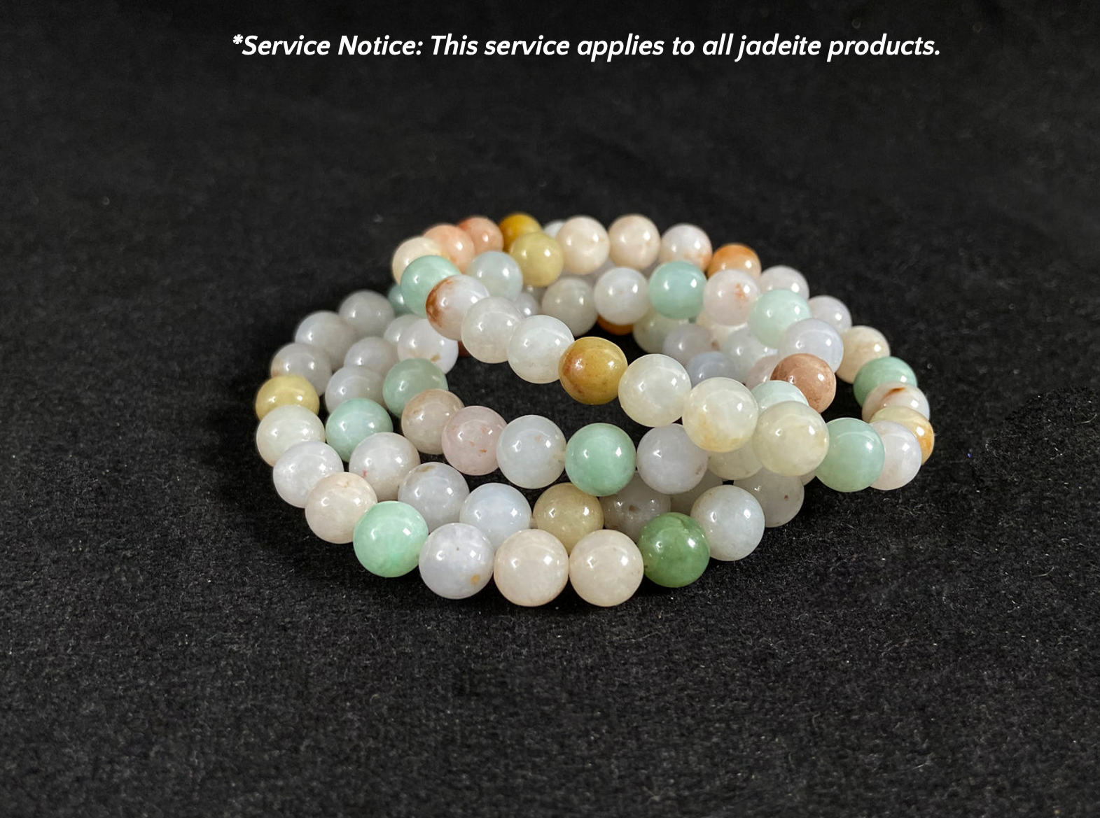 Jadeite bead necklace on a dark background with text overlay.