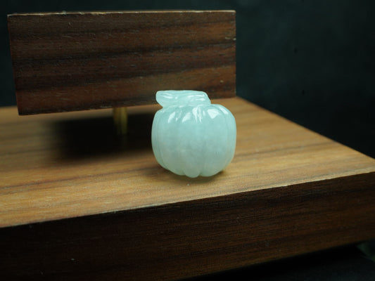 A mint green pumpkin loose jadeite.