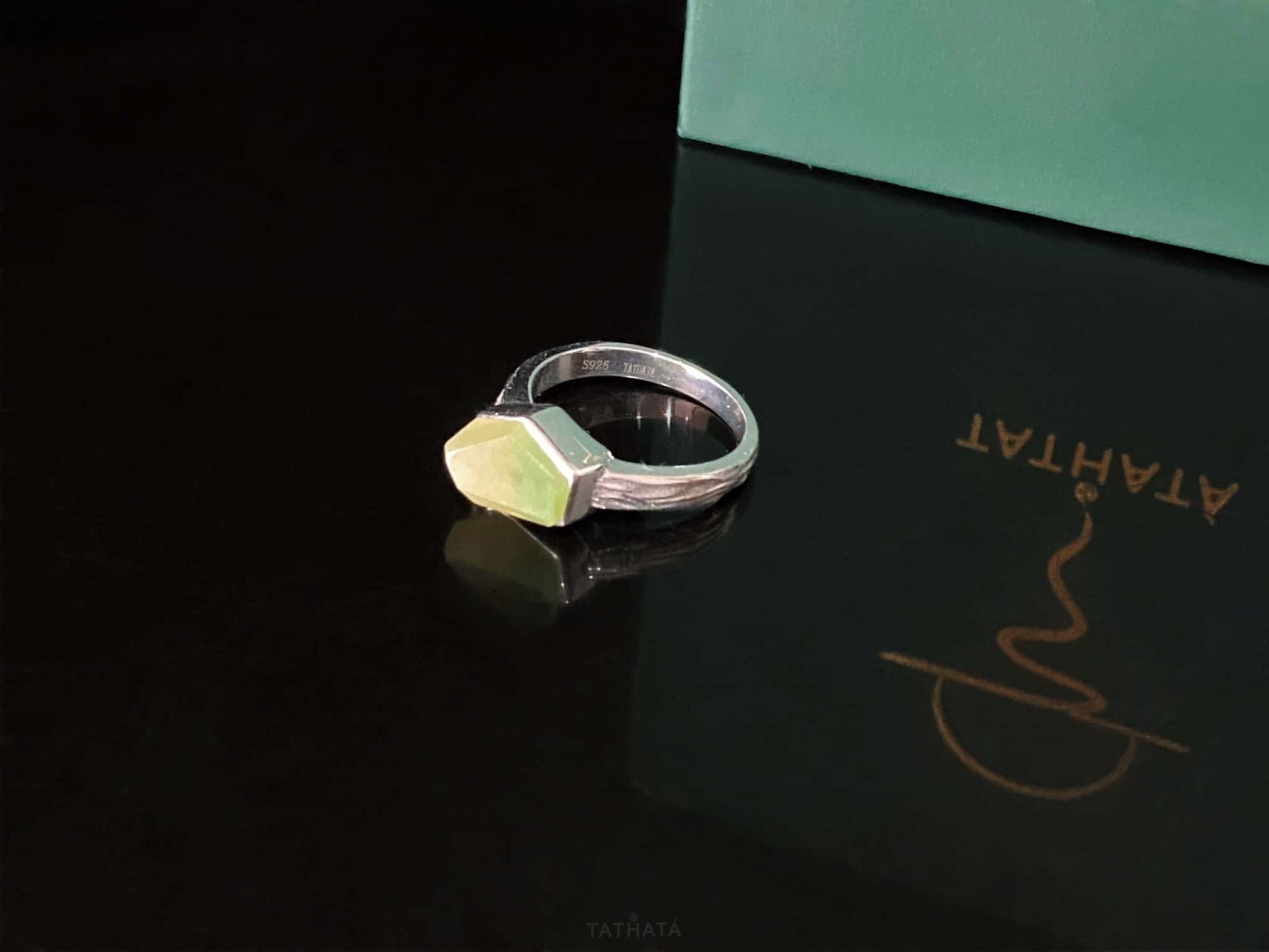 A honey lime gradient jadeite ring.