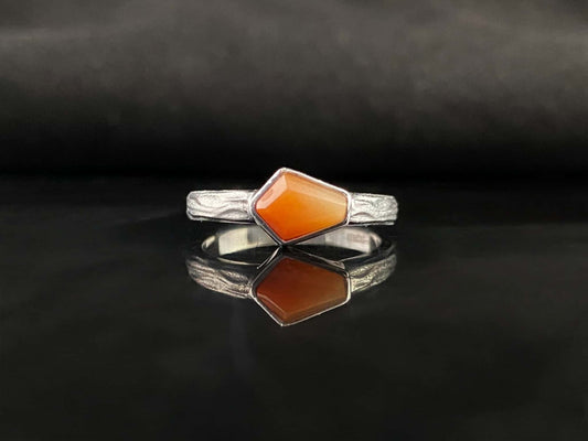A sunset orange gradient jadeite ring.