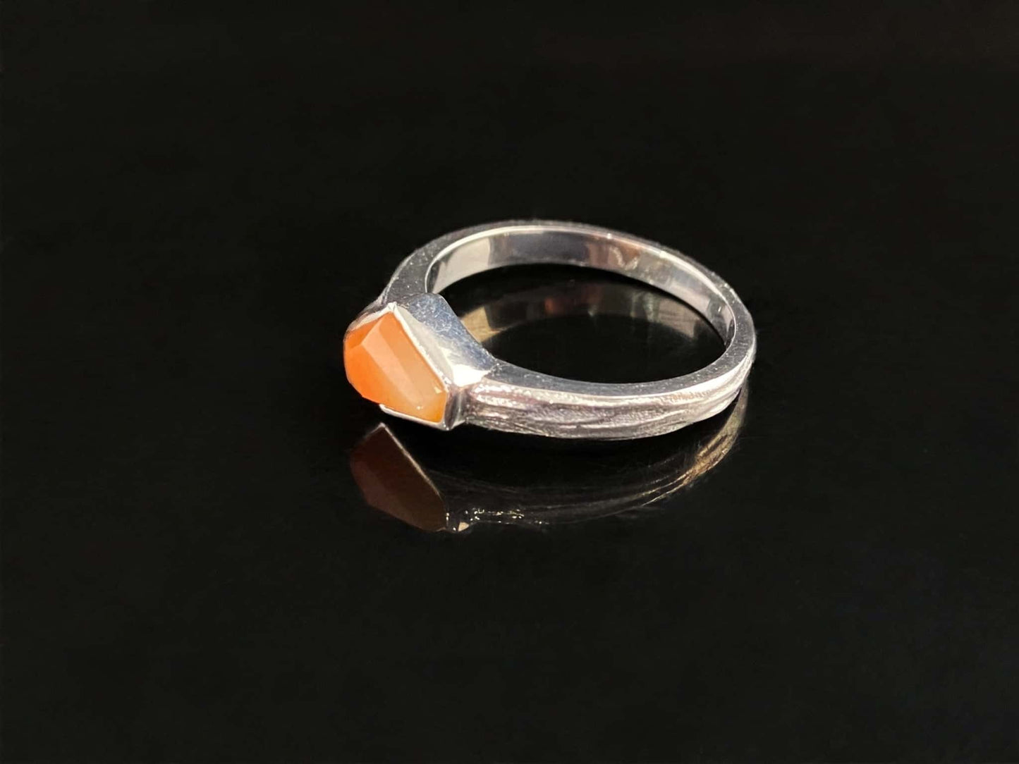 A sunset orange gradient jadeite ring.