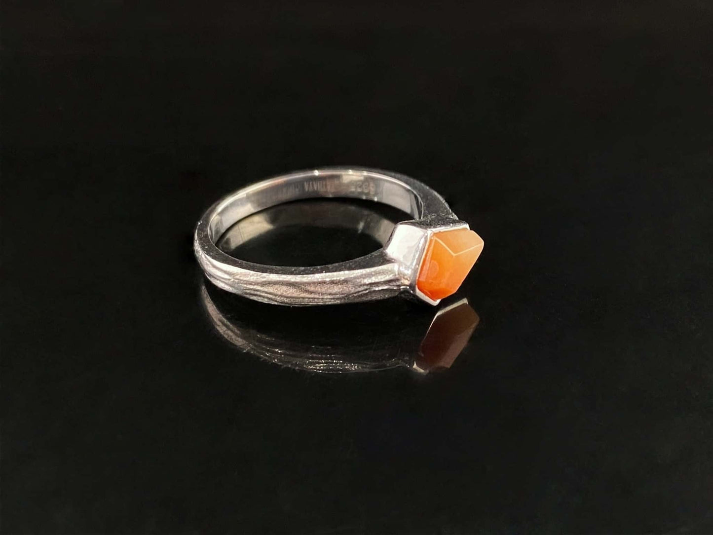A sunset orange gradient jadeite ring.