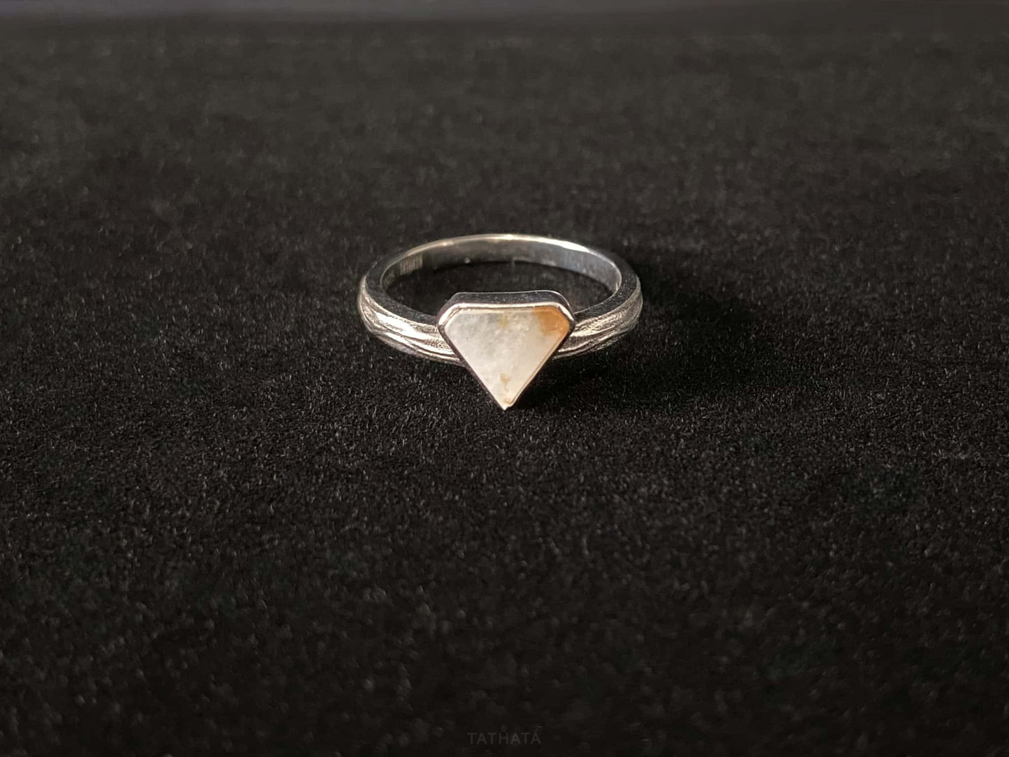 A sunset sugar triangle jadeite ring.