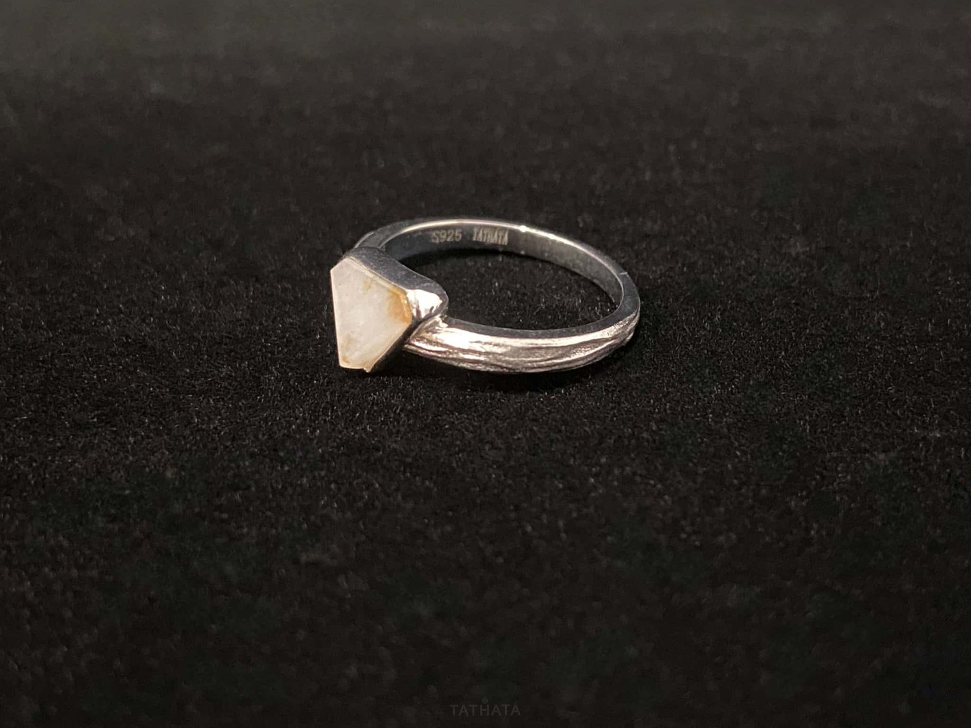 A sunset sugar triangle jadeite ring.