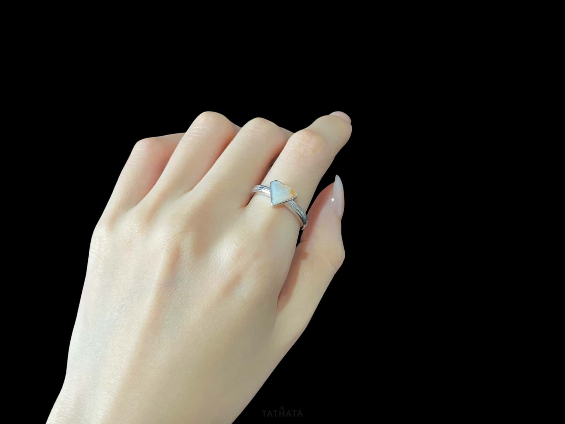 A sunset sugar triangle jadeite ring.