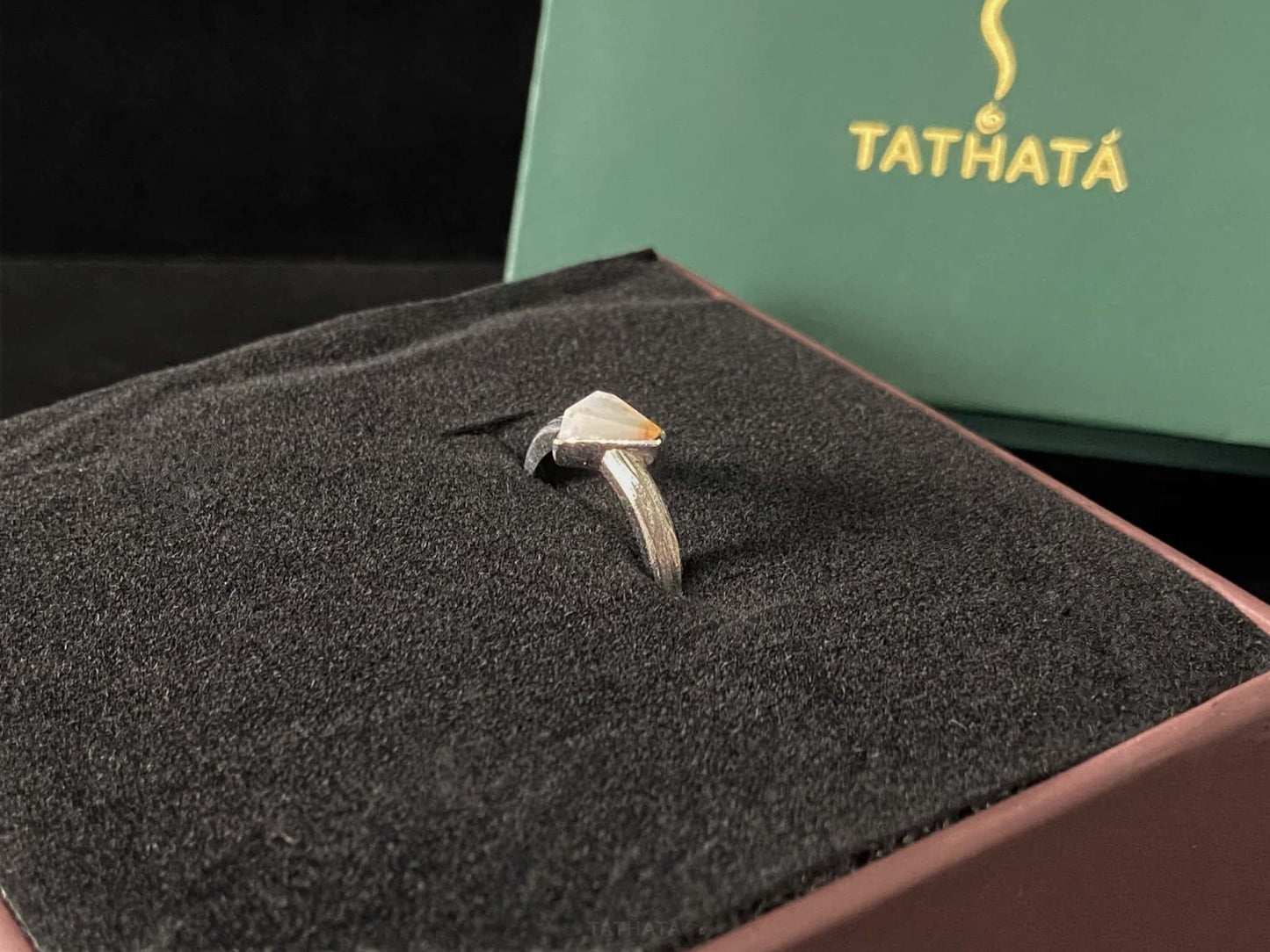 A sunset sugar triangle jadeite ring.