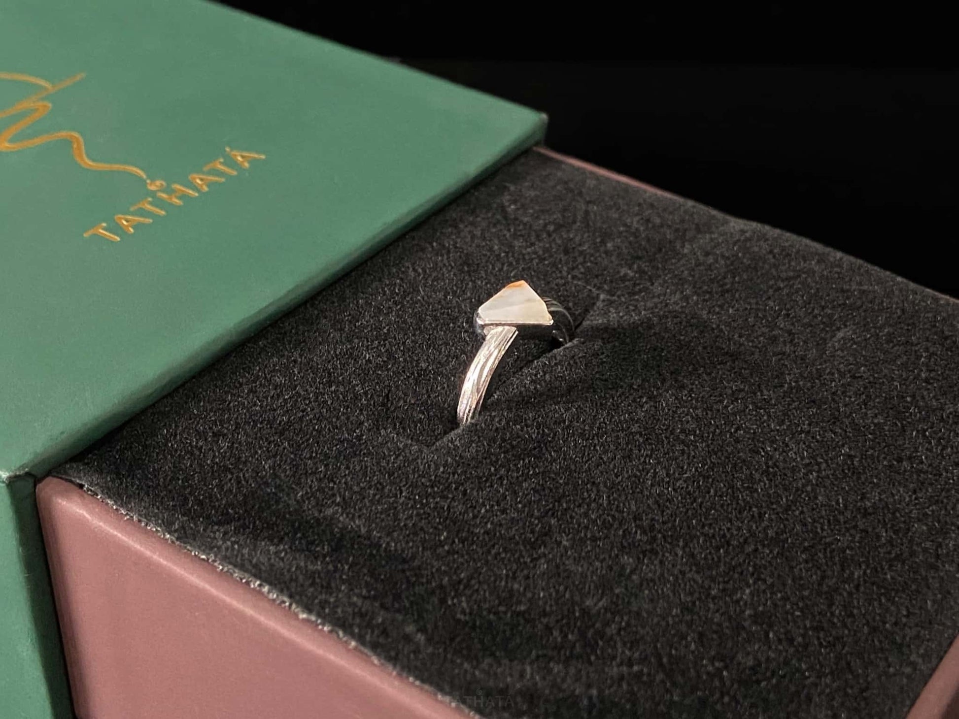 A sunset sugar triangle jadeite ring.
