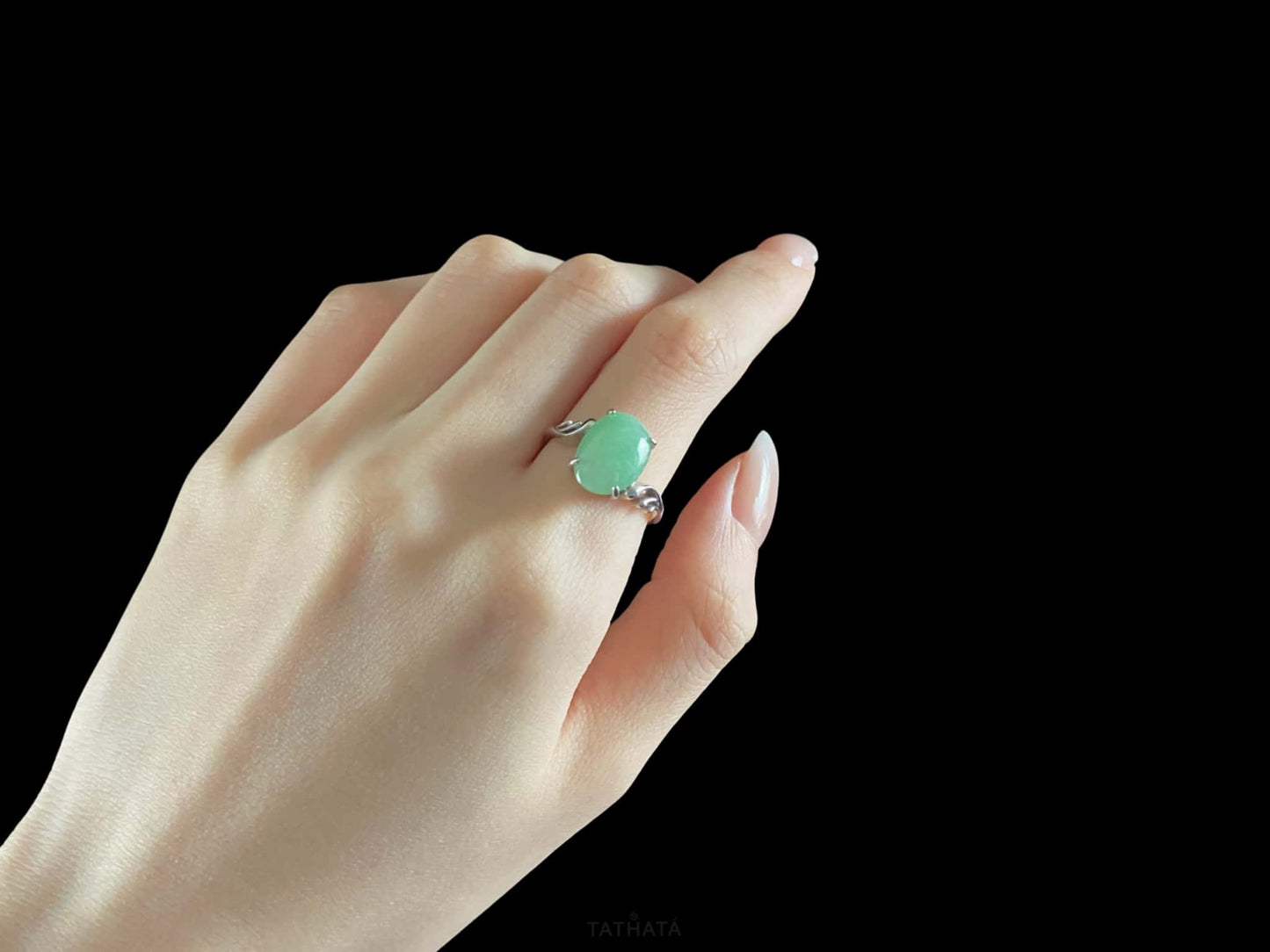 A mint dew oval jadeite ring.