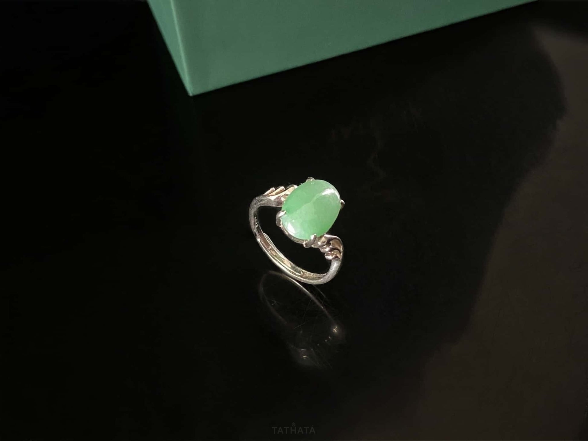 A mint dew oval jadeite ring.