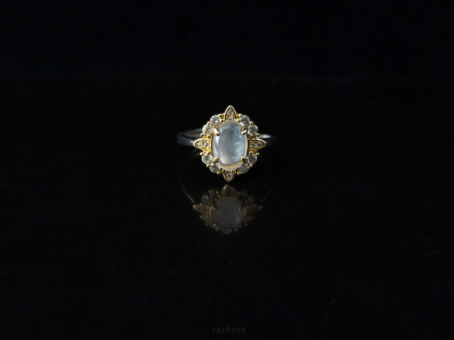 A moonlit oval flower jadeite ring.