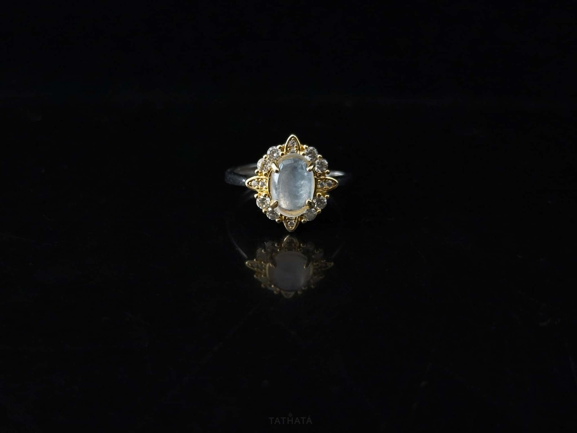 A moonlit oval flower jadeite ring.