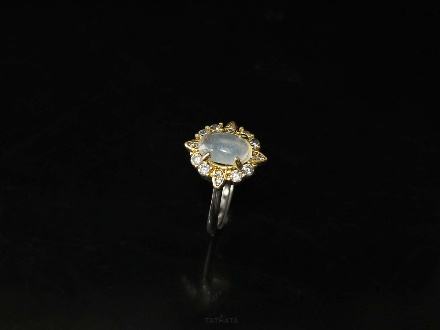 A moonlit oval flower jadeite ring.