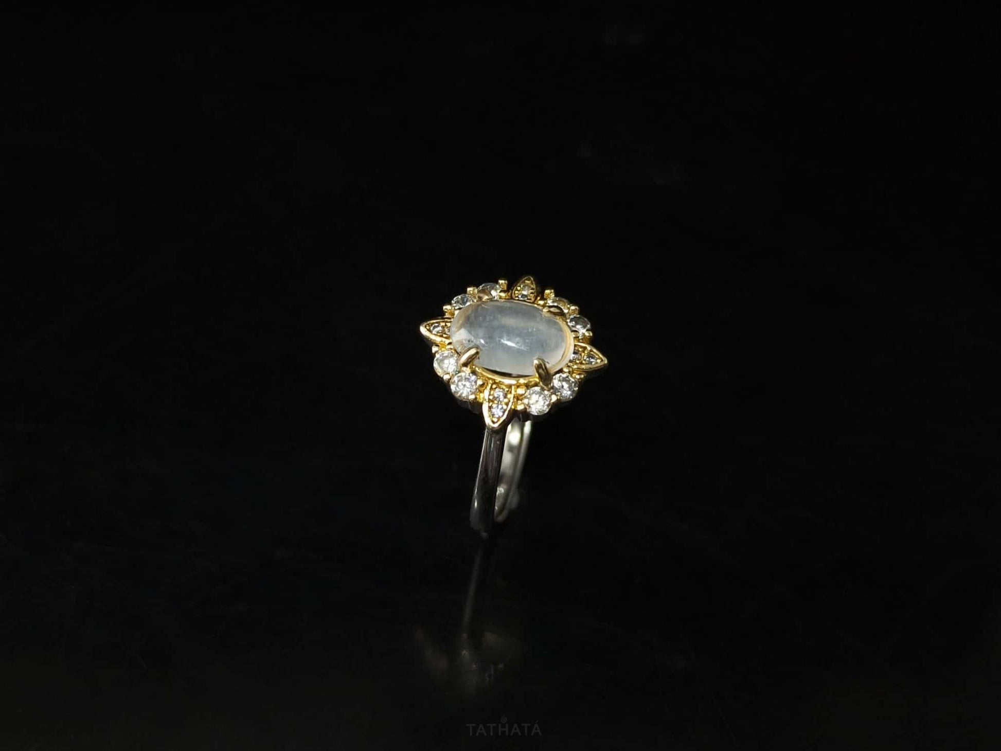 A moonlit oval flower jadeite ring.