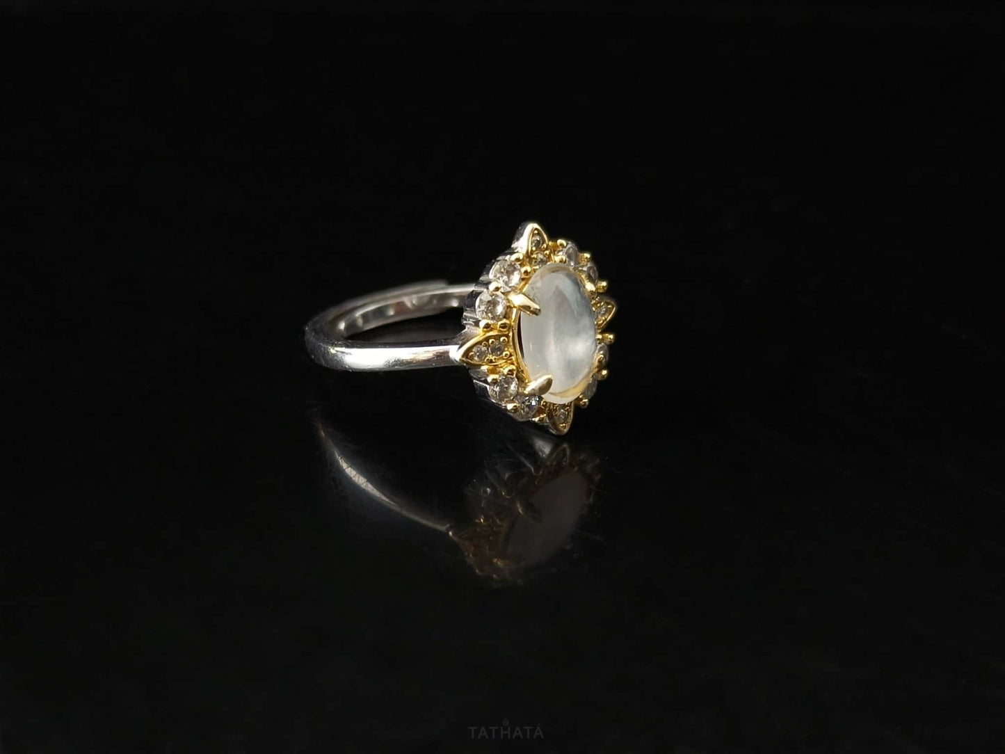 A moonlit oval flower jadeite ring.