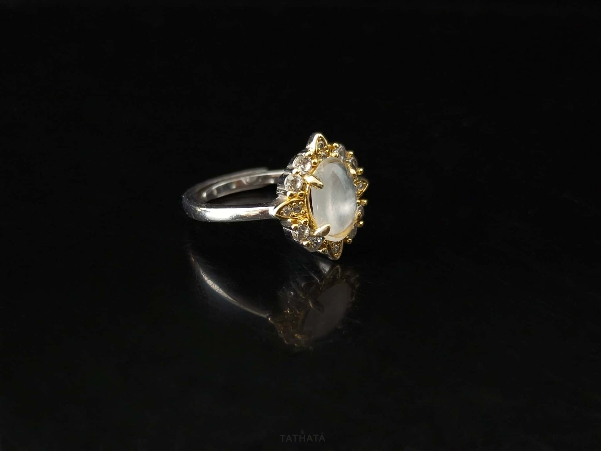 A moonlit oval flower jadeite ring.