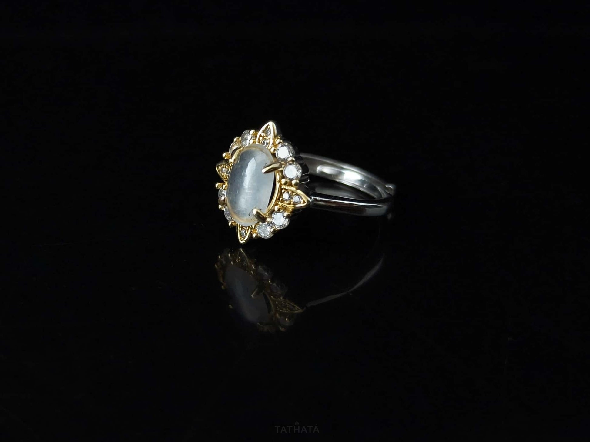 A moonlit oval flower jadeite ring.