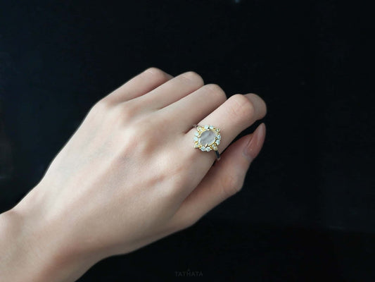 A moonlit oval flower jadeite ring.