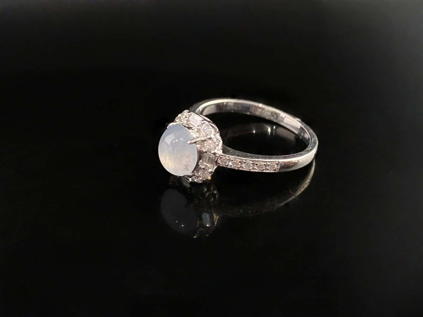 A pale dew drop jadeite ring.