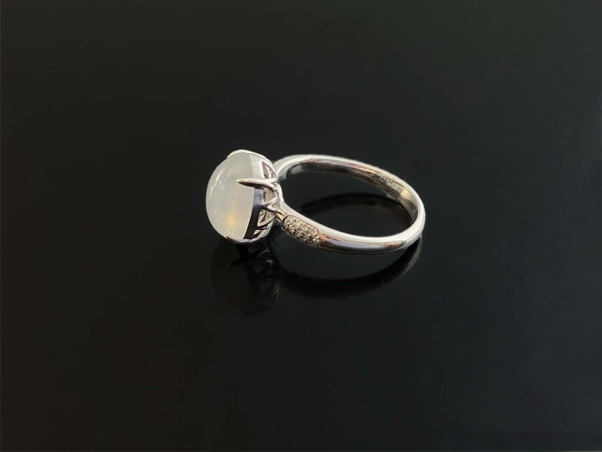 A moonlit ice cabochon jadeite ring. 