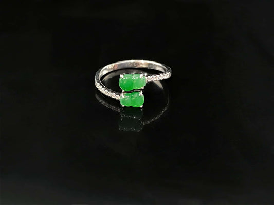 A bright green double gourd jadeite ring.