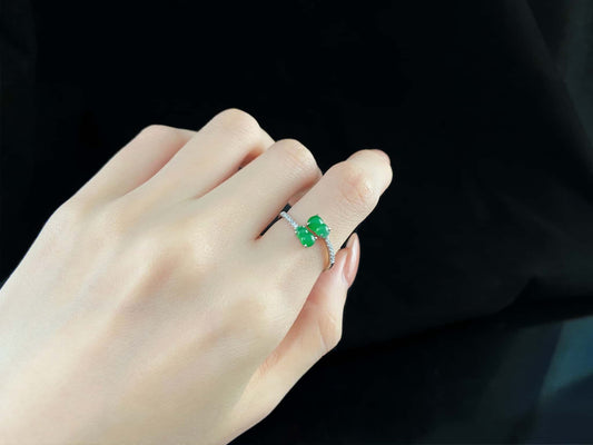 A bright green double gourd jadeite ring.