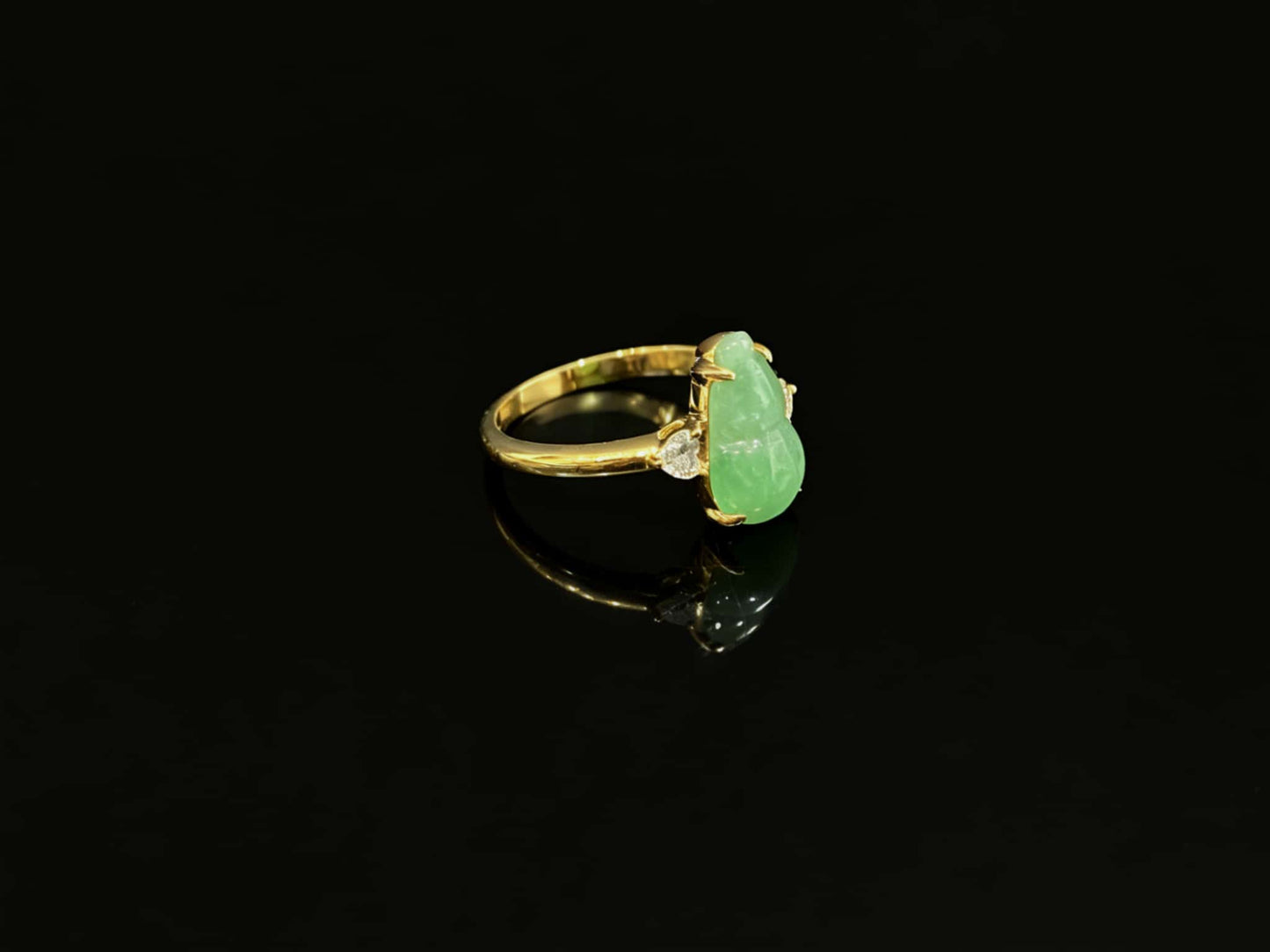 A prosperity gourd jadeite ring.