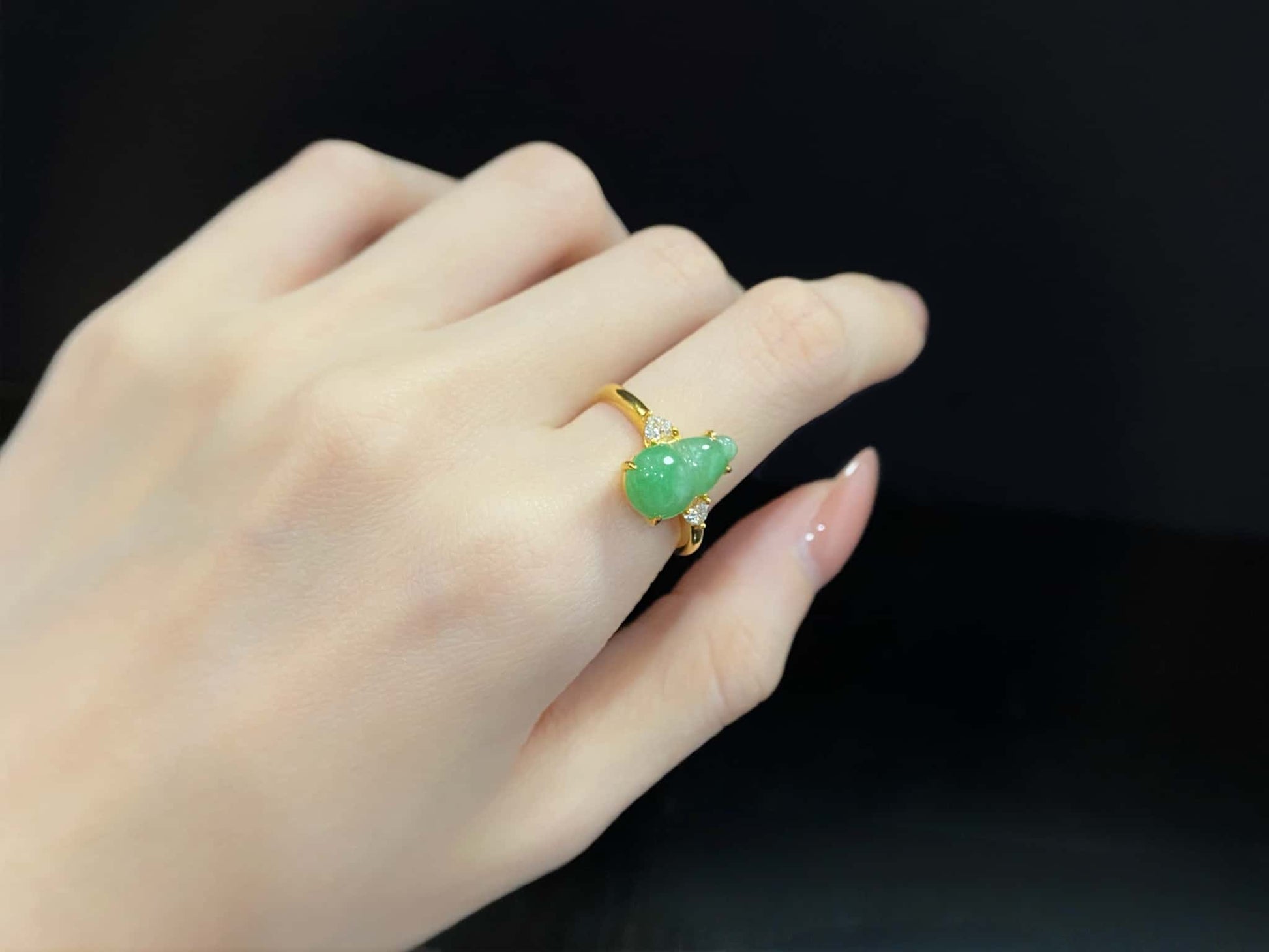 A prosperity gourd jadeite ring.