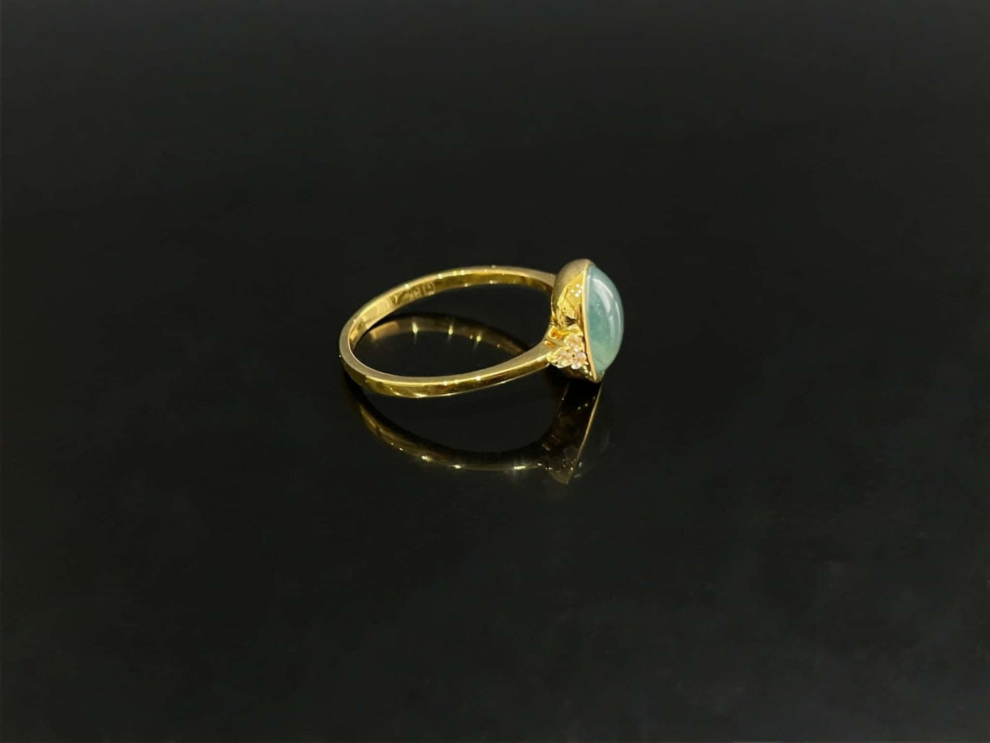 A lagoon blue-green jadeite ring.