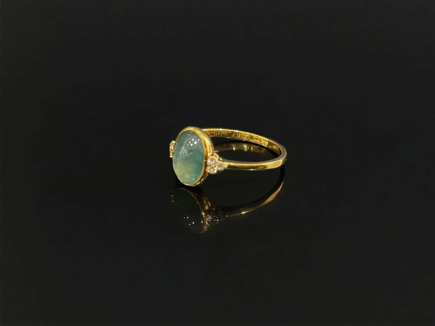 A lagoon blue-green jadeite ring.