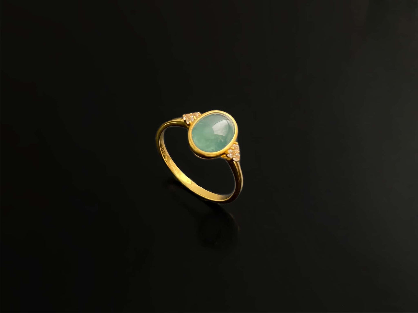 A lagoon blue-green jadeite ring.