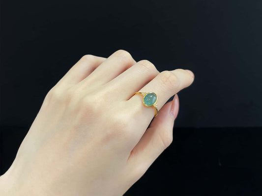 A lagoon blue-green jadeite ring.