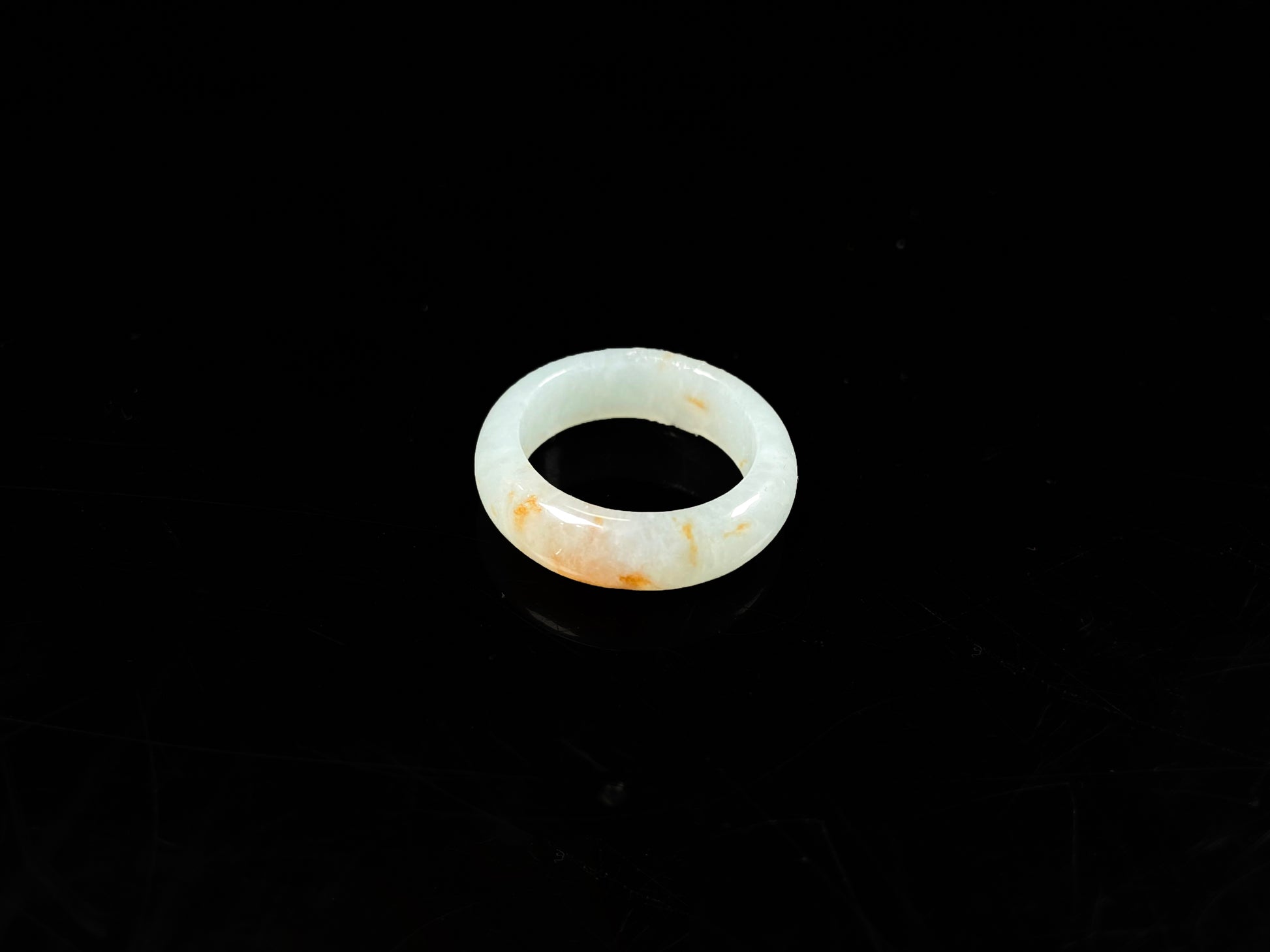 A icy white amber spark jadeite ring.