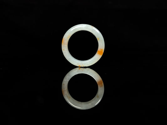 A icy white with amber hue jadeite ring.