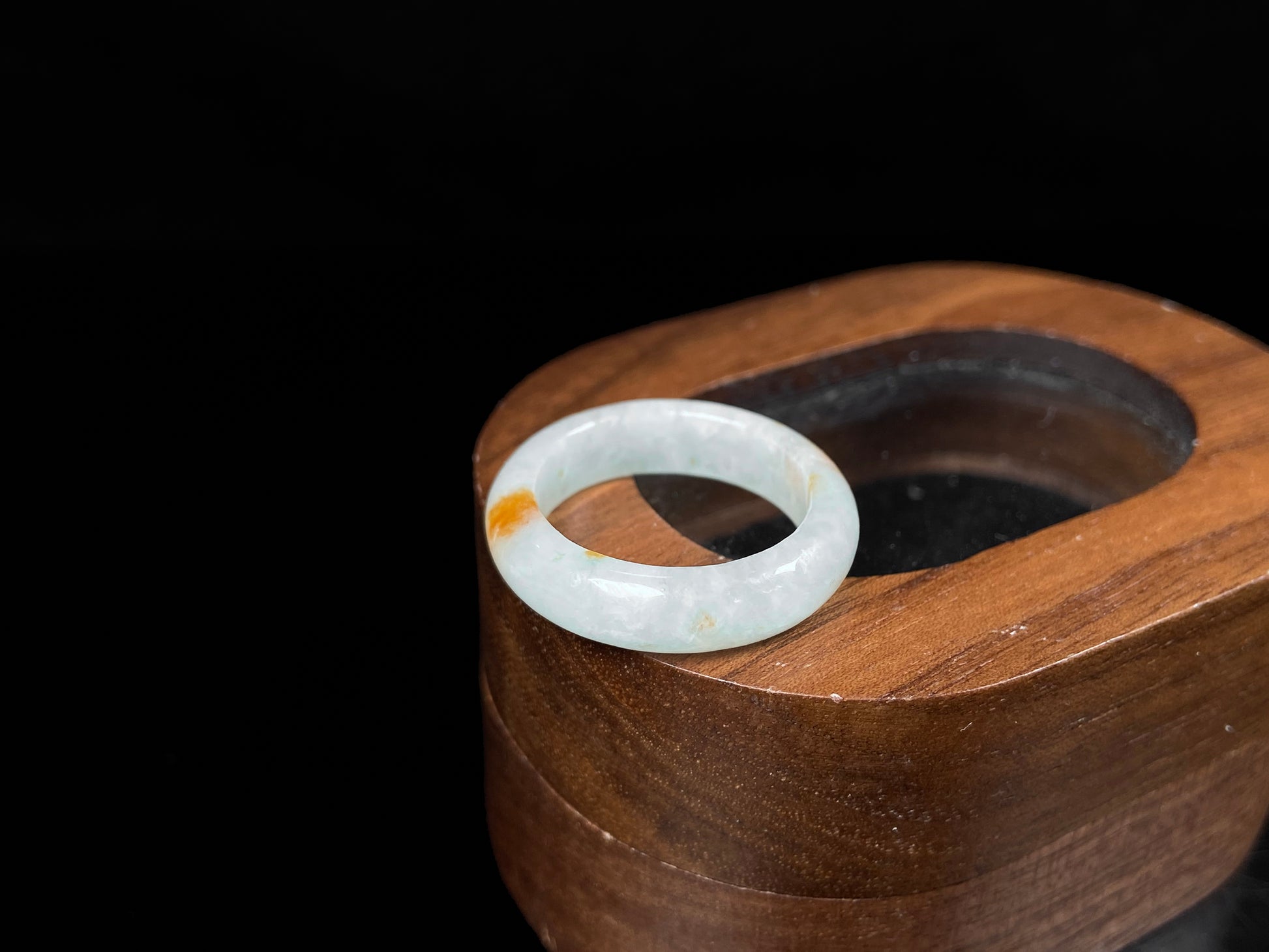 A icy white with amber hue jadeite ring.