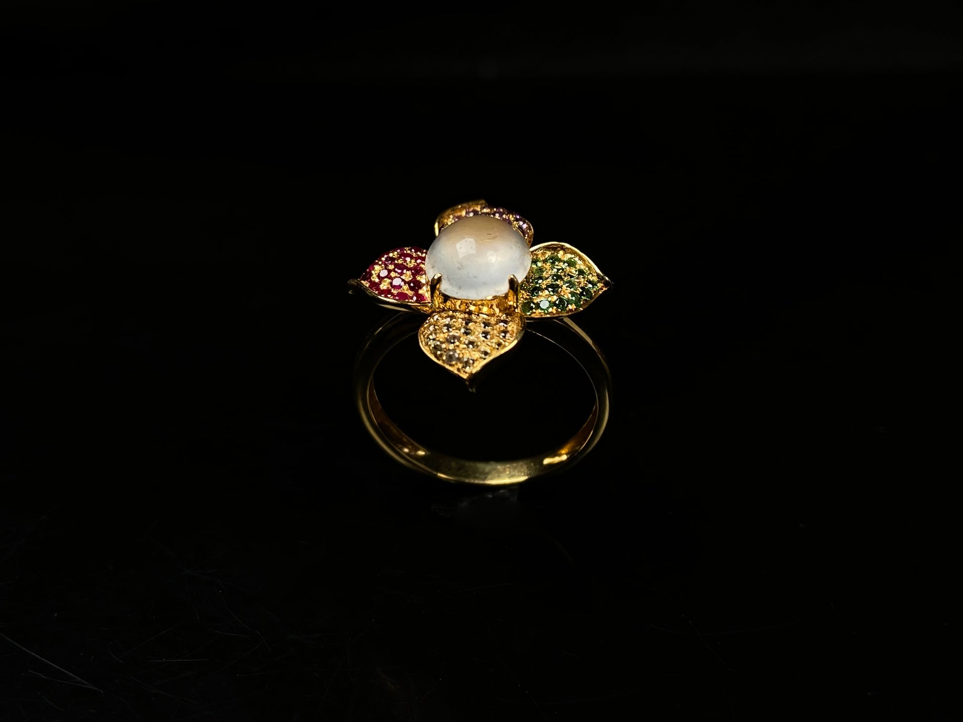 A icy white with vibrant petal jadeite ring.