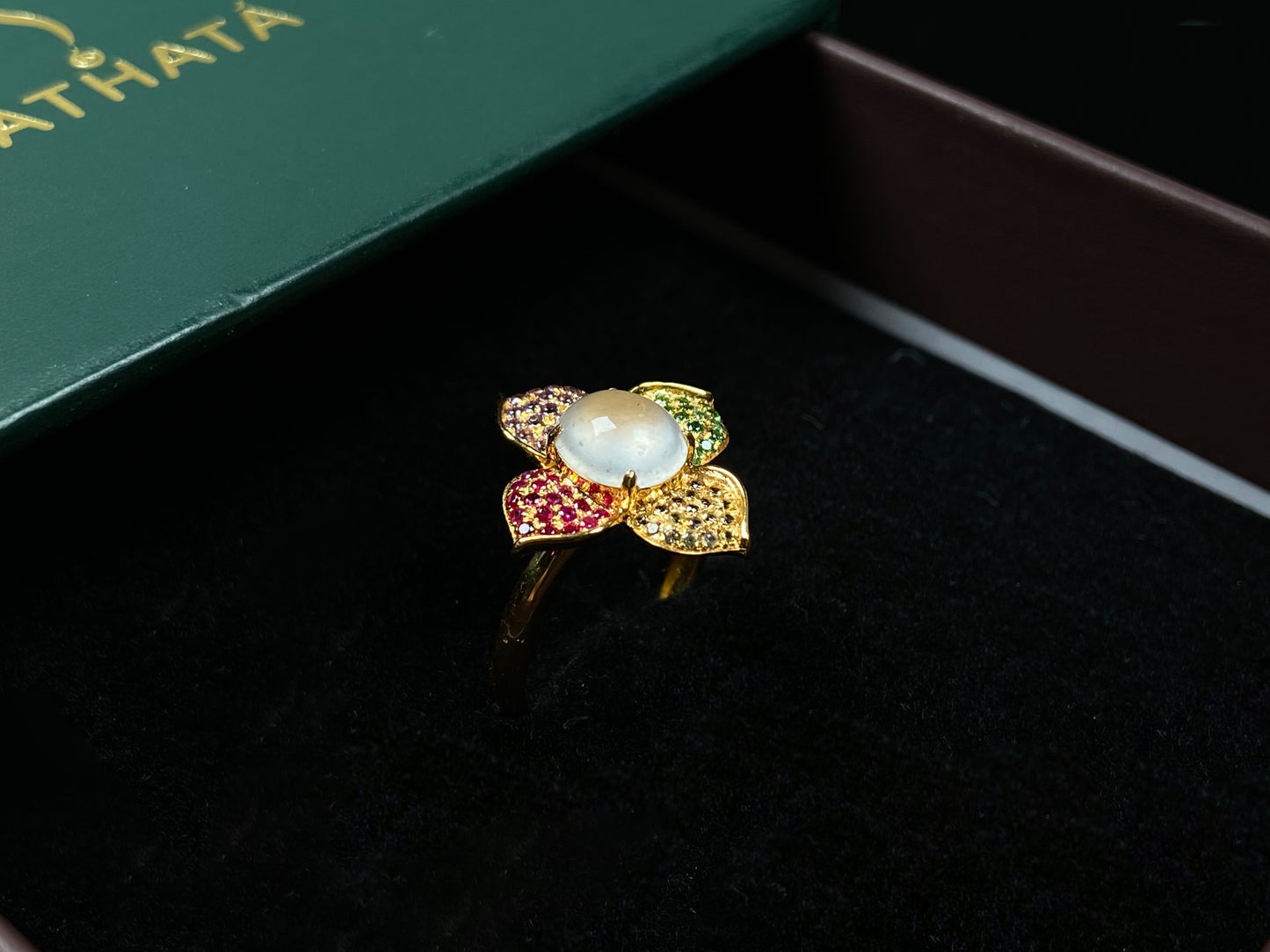 A icy white with vibrant petal jadeite ring.