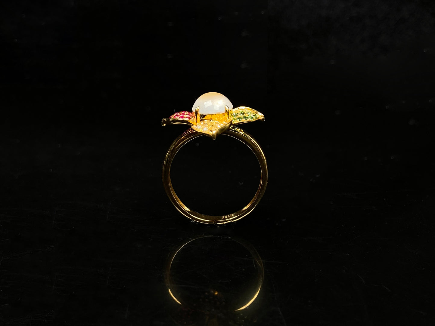 A icy white with vibrant petal jadeite ring.
