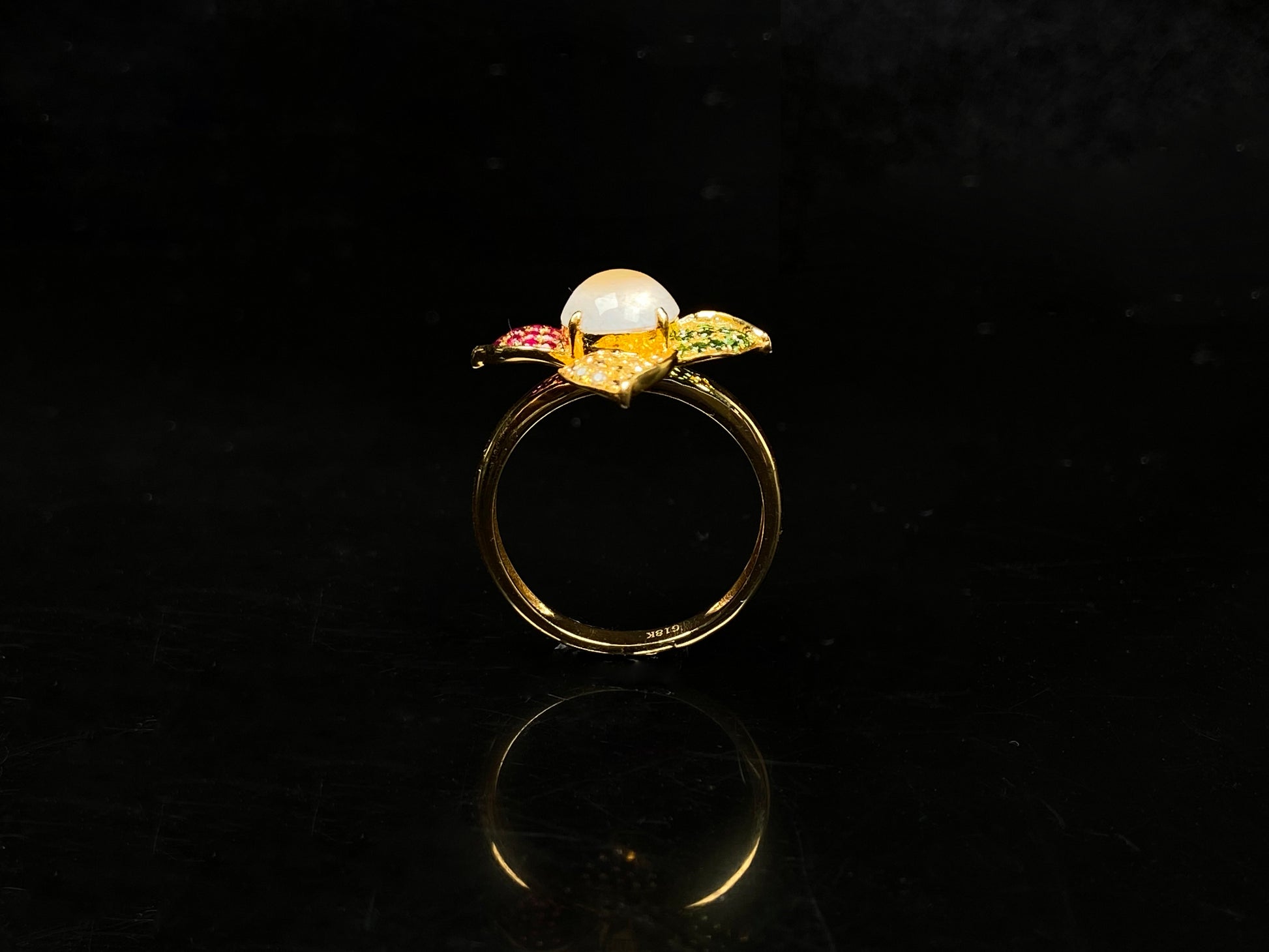 A icy white with vibrant petal jadeite ring.
