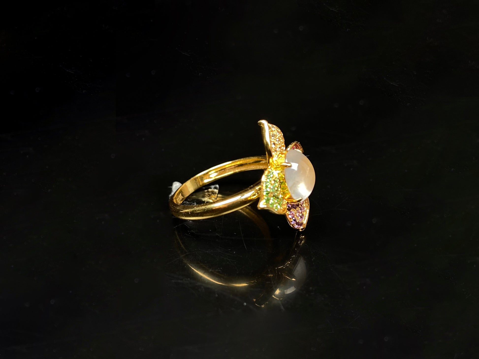 A icy white with vibrant petal jadeite ring.