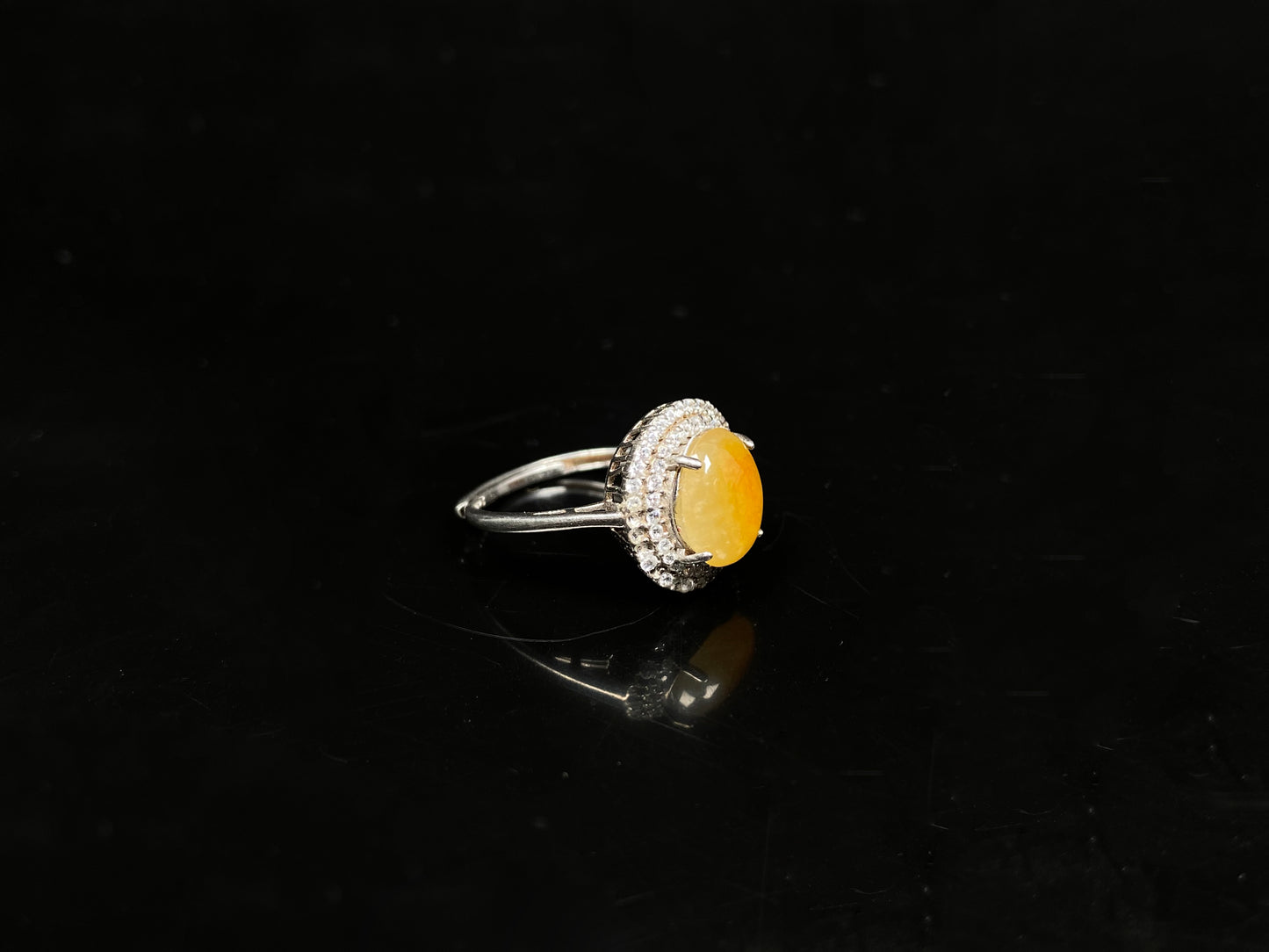 A sunlit nectar glow jadeite ring.