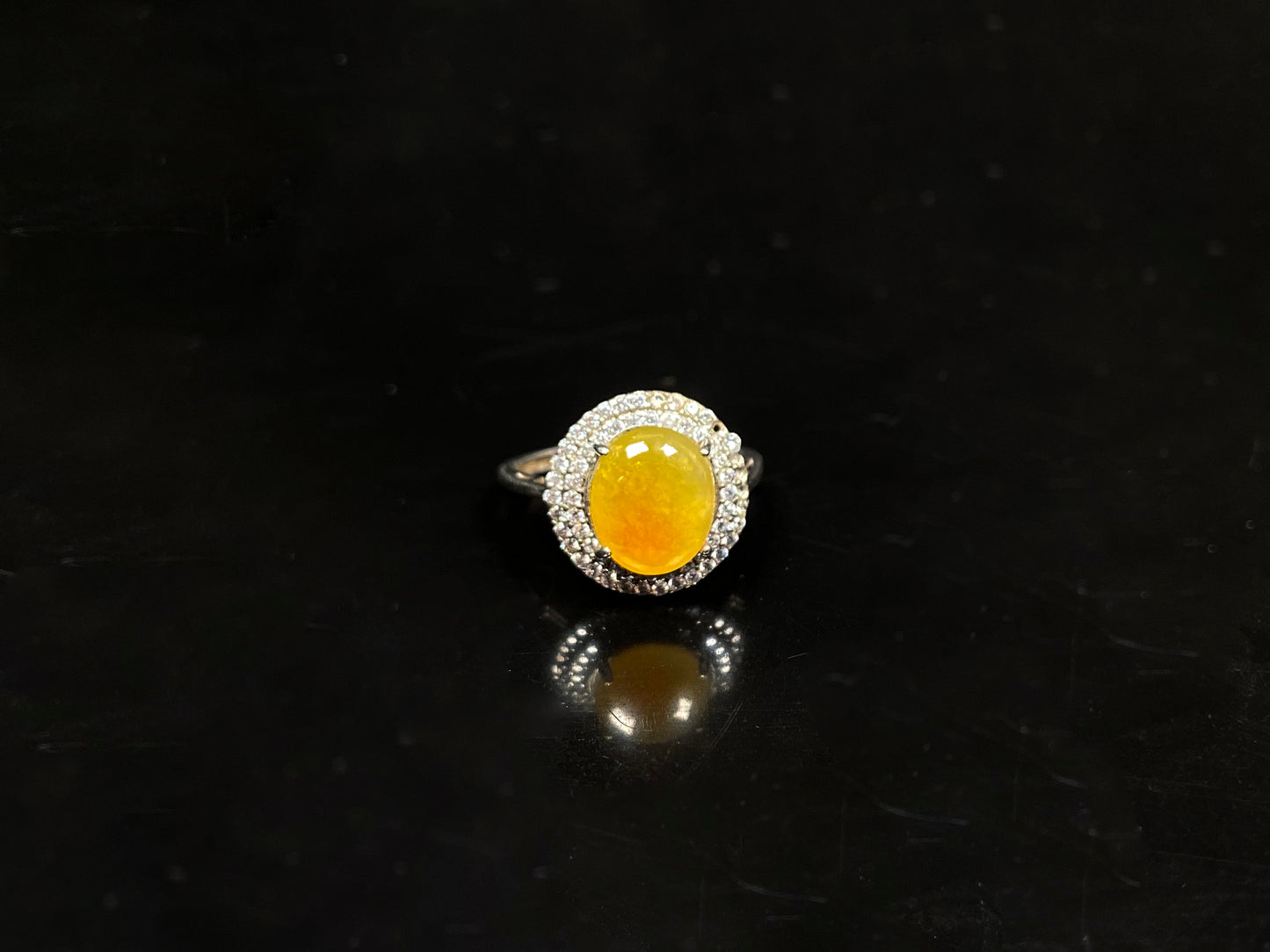 A sunlit nectar glow jadeite ring.