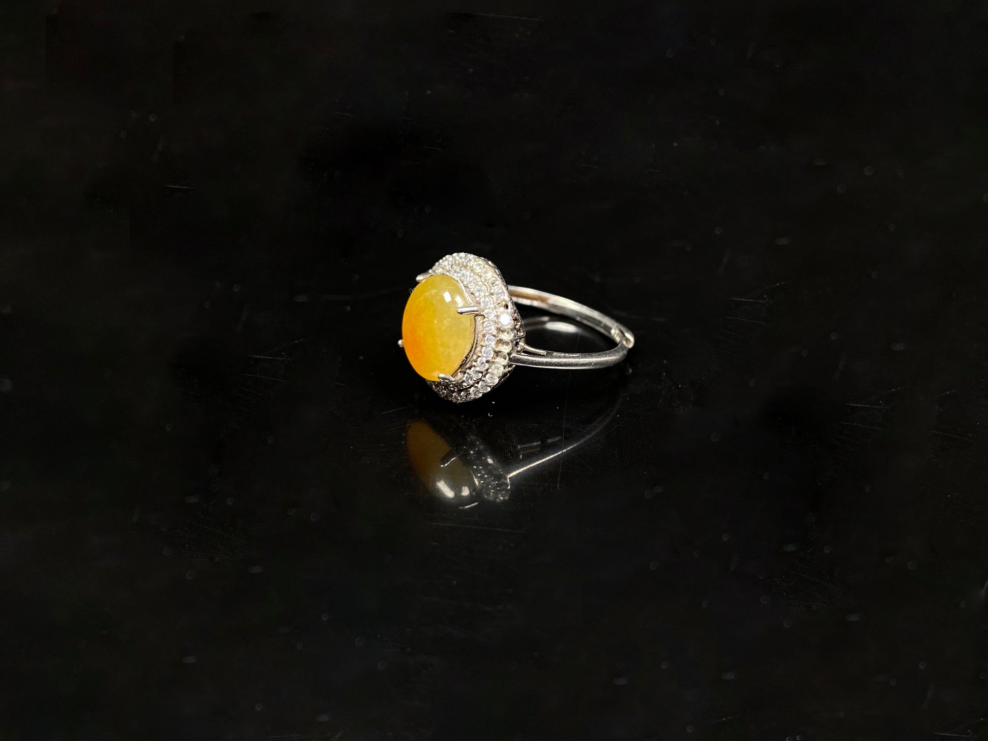 A sunlit nectar glow jadeite ring.
