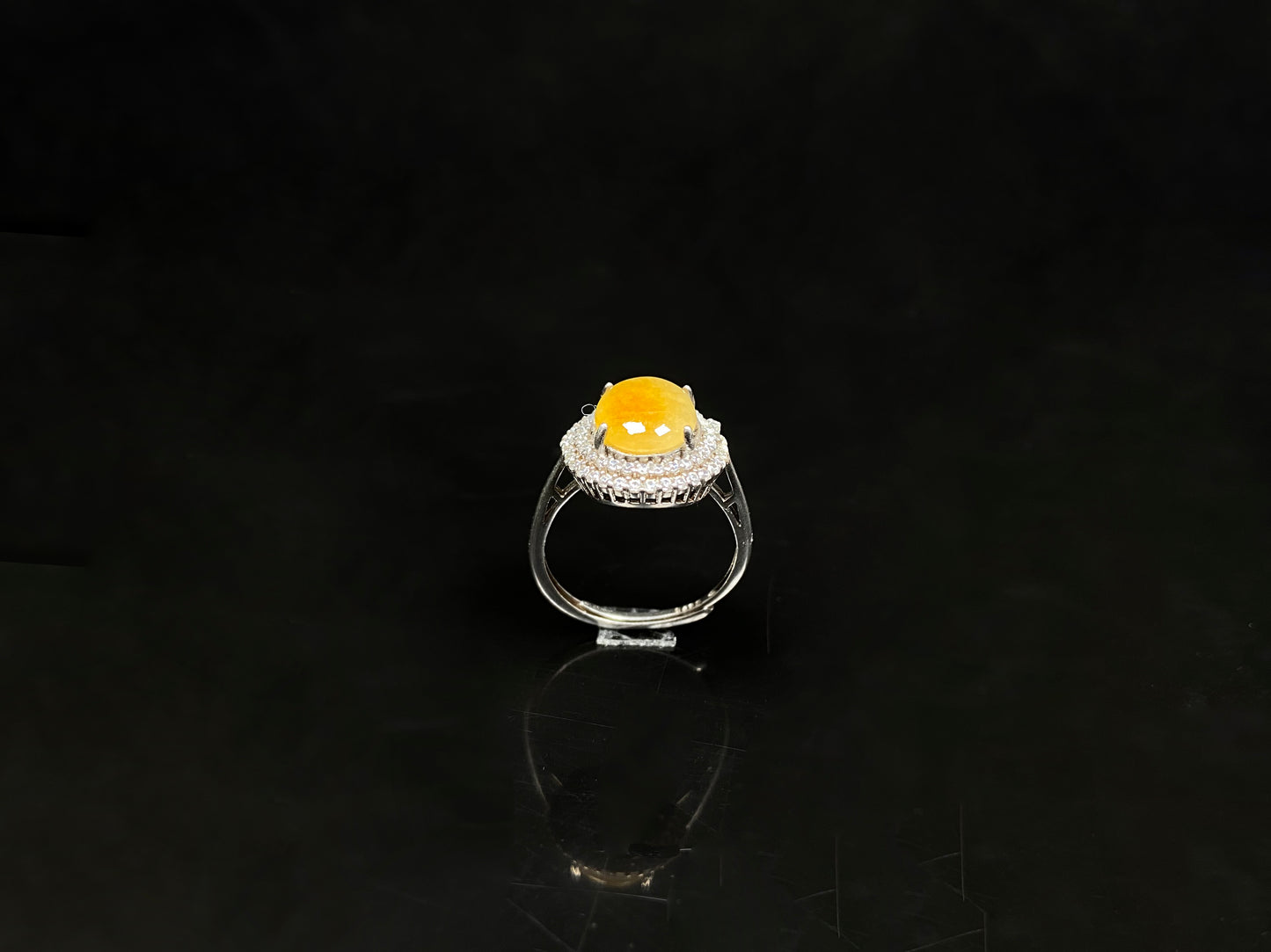 A sunlit nectar glow jadeite ring.